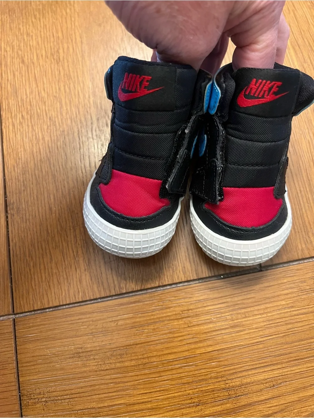Nike Kids Black High-Top Sneakers with Blue and Red Accents